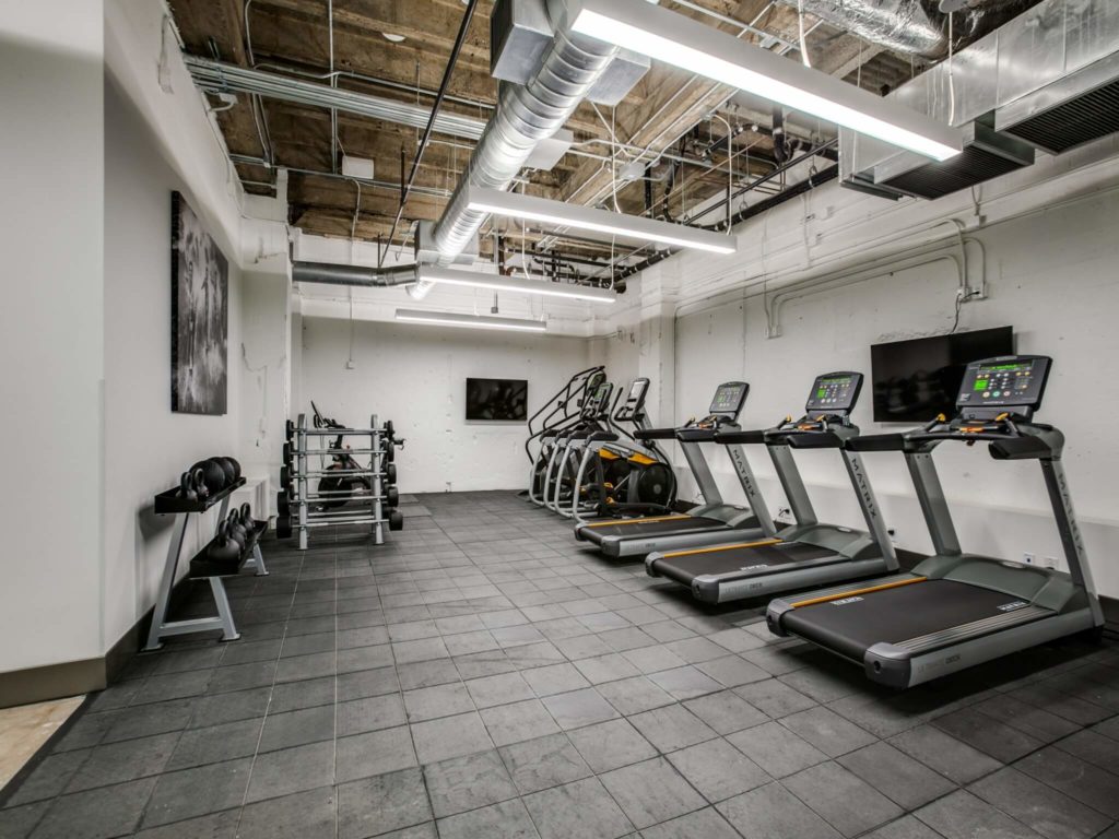 Dallas, TX Apartments for Rent - The Drakestone Fitness Center with Ellipticals, Treadmills, and Free Weights